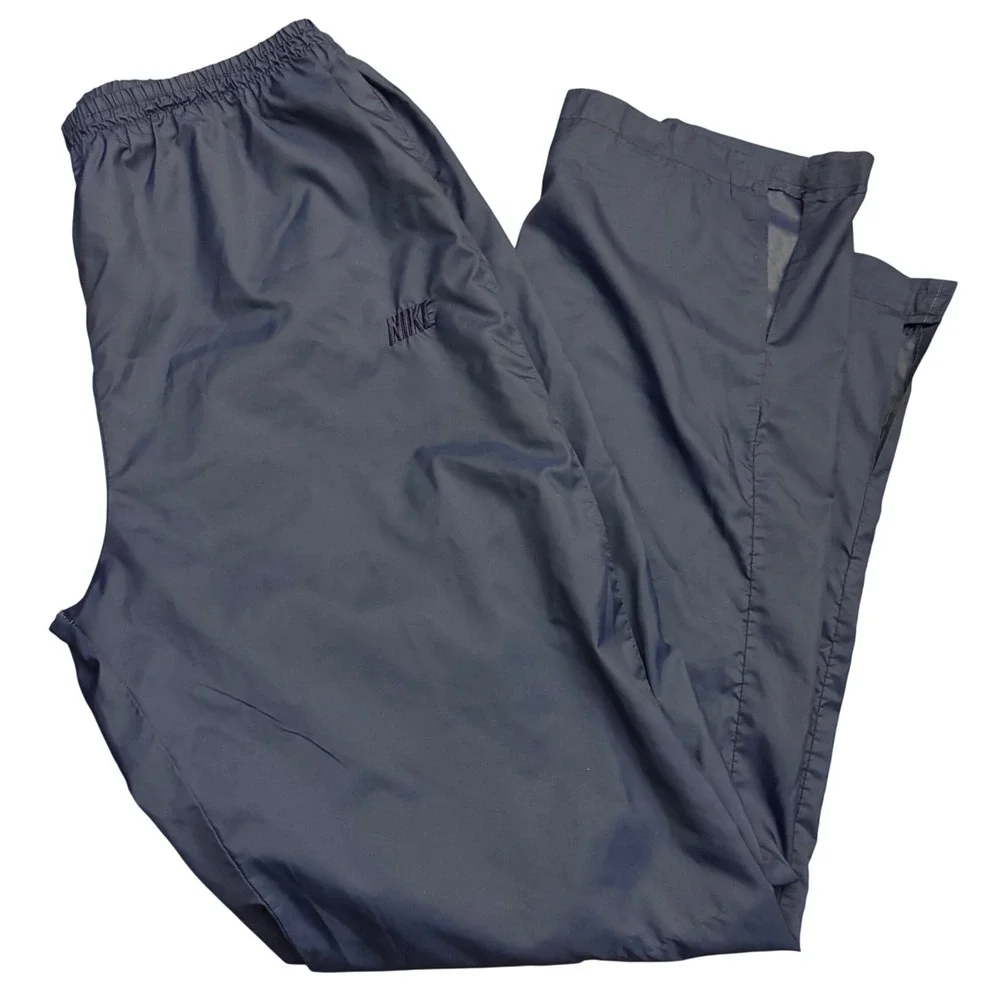 Vintage Nike | Mens L Navy Blue Nylon Windbreaker Track‎ Pants | 90s | cuff slit